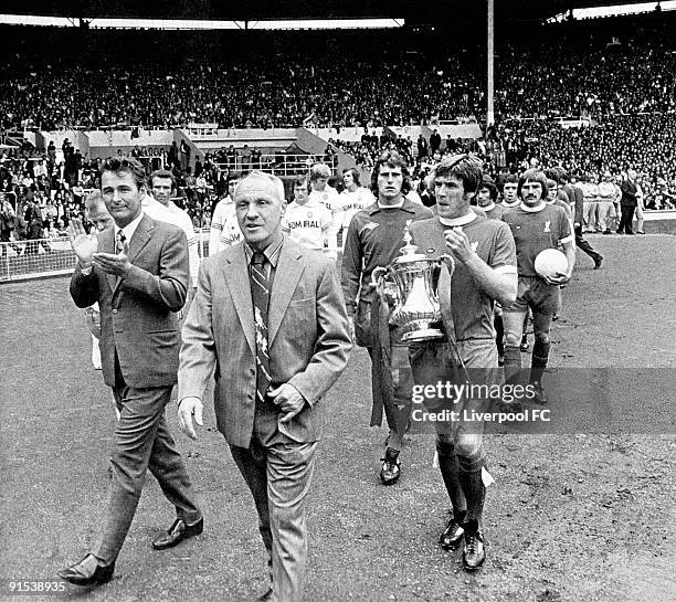 Brian Clough, manager of Leeds United, applauds Bill Shankly, manager of Liverpool, as they walk out before the FA Charity Shield match between...