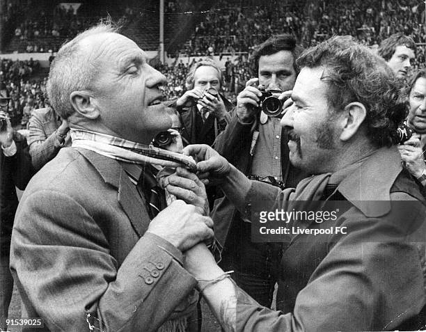 An adoring fan ties a scarf around the neck of the retiring Bill Shankly, manager of Liverpool, after the FA Charity Shield match between Liverpool...