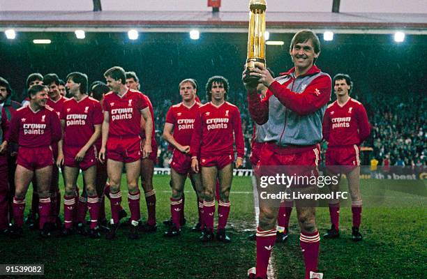 Liverpool player/manager Kenny Dalglish poses with the Canon League Division One trophy before the Screen Sport Super Cup Semi-Final Second Leg match...