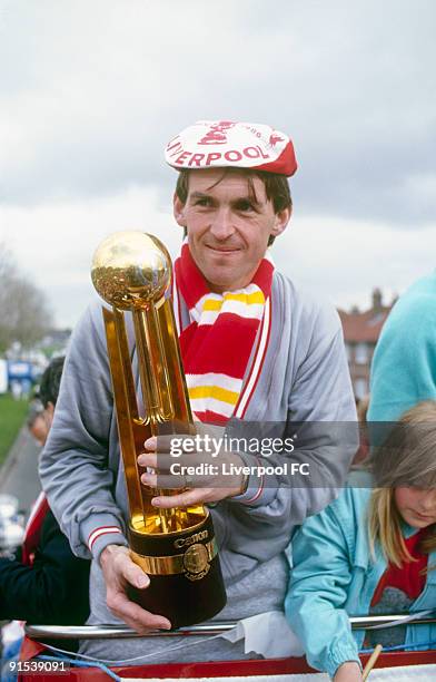 Liverpool player/manager Kenny Dalglish celebrates being the FA Cup and Canon League Division One champions, and parades the trophies during a open...