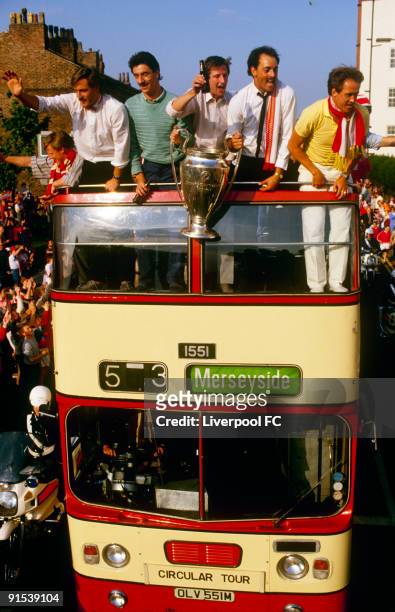 Liverpool players parade the European cup trophy from on top of an open bus for a victory parade through the city David Hodgson, Ian Rush, Ronnie...