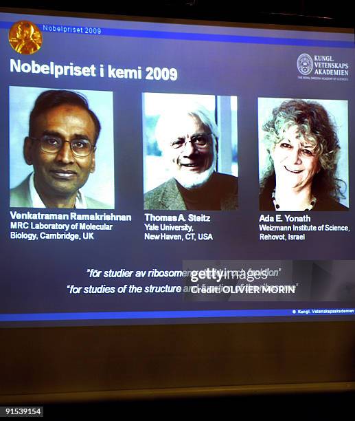 Photos of Venkatraman Ramakrishnan and Thomas Steitz of the US and Israel's Ada Yonath are displayed on a screen as they win the Nobel Chemistry...