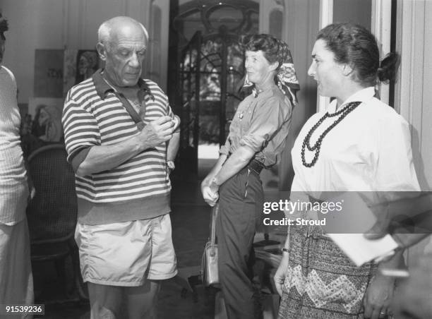 Spanish artist Pablo Picasso in his studio with his model, Jacqueline Roque , 1955. He and Jacqueline were married in 1961.