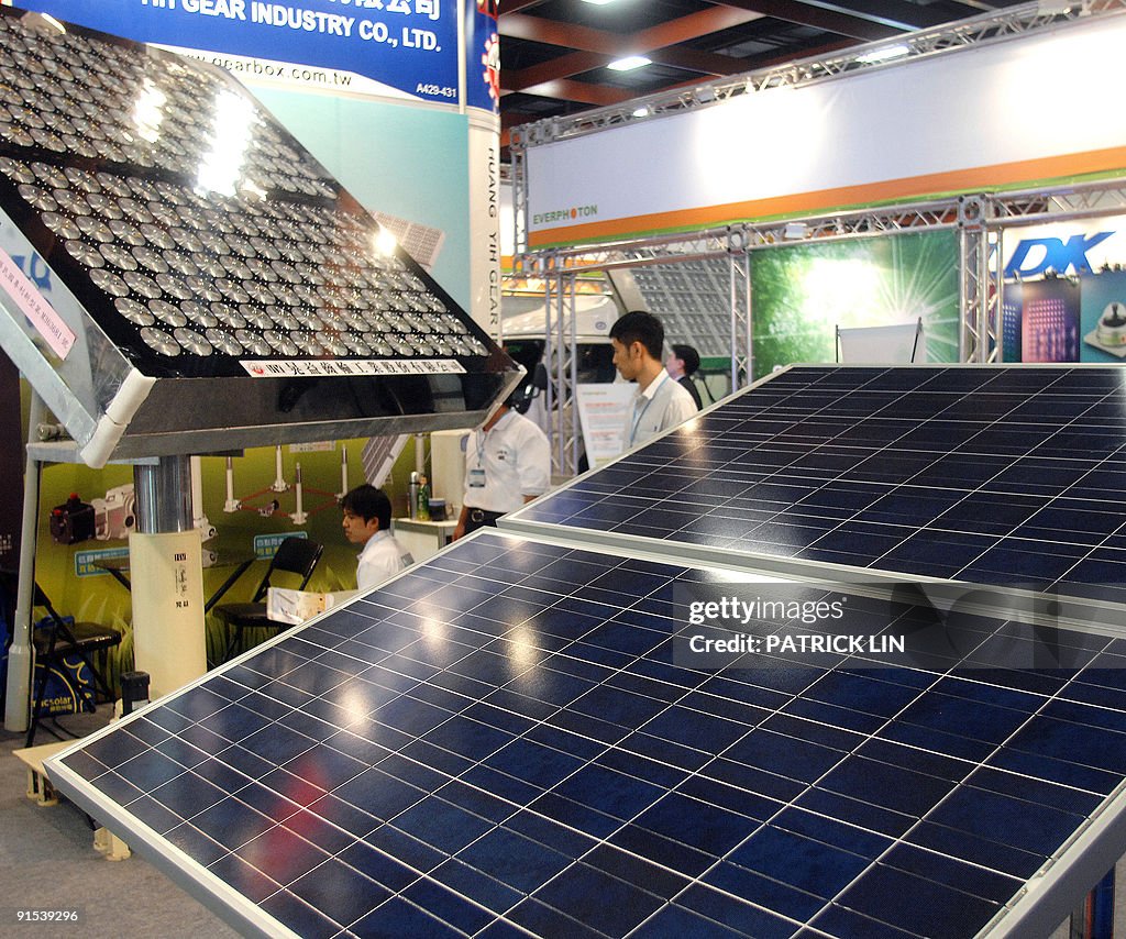 Large solar panels are displayed at the