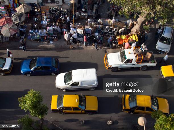 high angle view image of street in dakar city, senegal - africa road stock pictures, royalty-free photos & images