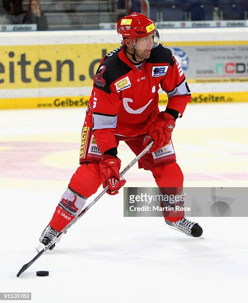 Aris Brimanis of Hannover skates with the puck during the DEL match between Hannover Scorpions and Adler Mannheim at the TUI Arena on October 6, 2009...