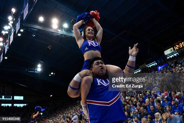 Kansas Jayhawks cheerleaders perform during a game against the Oklahoma State Cowboys at Allen Fieldhouse on February 3, 2018 in Lawrence, Kansas.