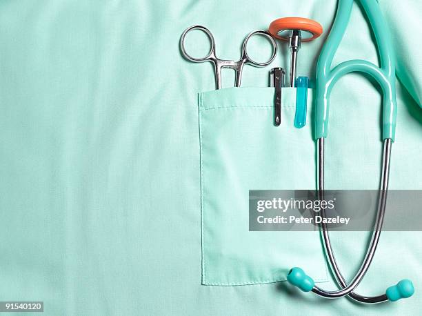 doctors pockets with medical instruments. - estetoscópio fotografías e imágenes de stock