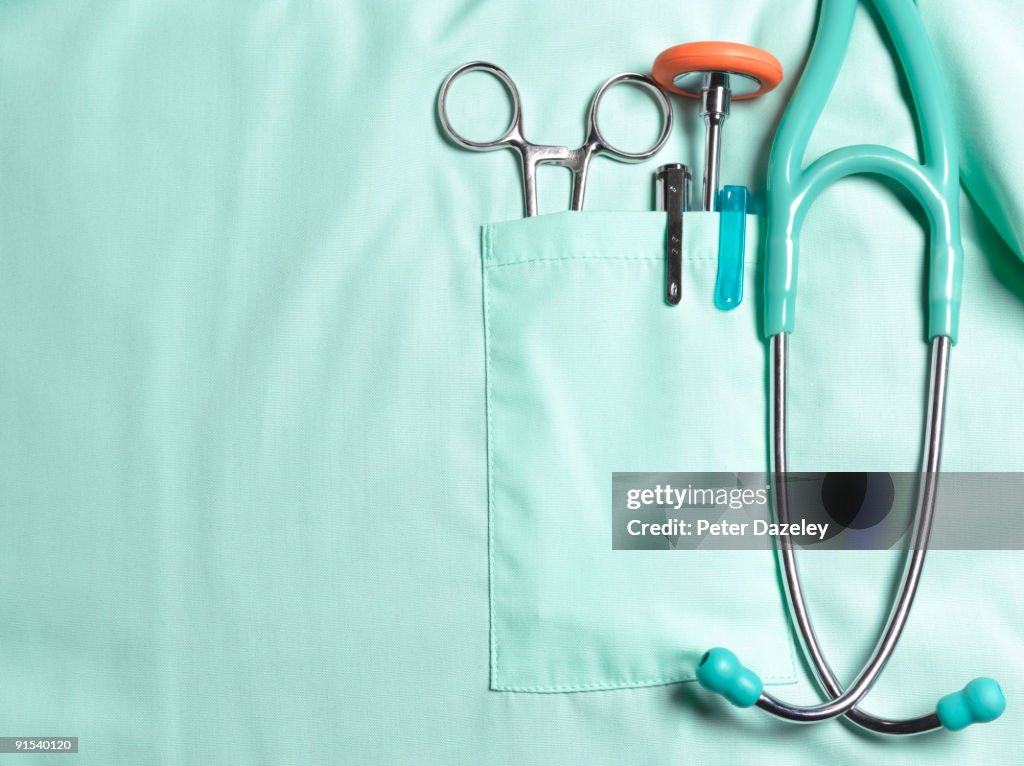 Doctors pockets with medical instruments.