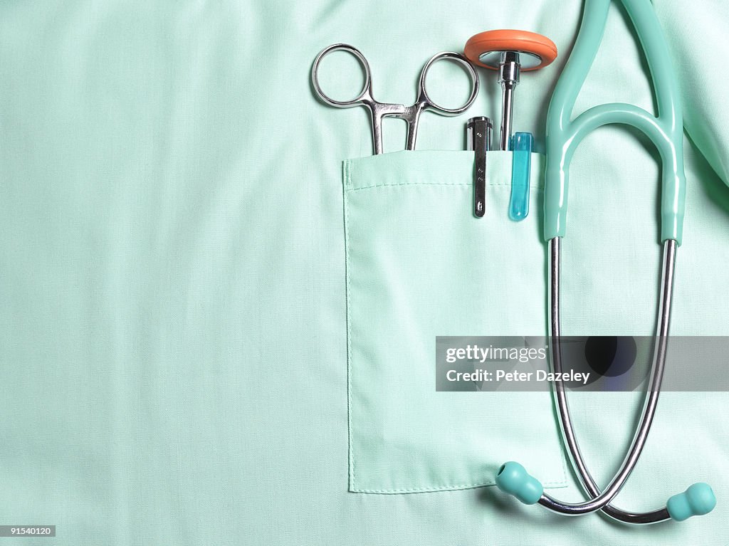 Doctors pockets with medical instruments.