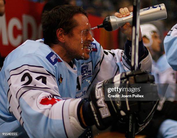 John Tripp of Hamburg sprays water on his face during the DEL match between Hamburg Freezers and Nuernberg Ice Tigers at the Color Line Arena on...