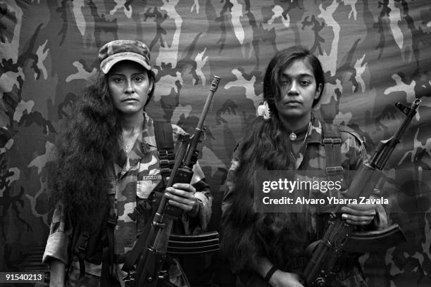 Judith and Isa, two female FARC guerrillas from the bloque movil Arturo Ruiz, inside one of the FARC camps. The Bloque Movil Arturo Ruiz of the...