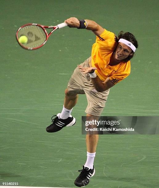 Juan Monaco of Argentina serves in his match against Guillermo Garcia-Lopez of Spain during day three of the Rakuten Open Tennis tournament at Ariake...