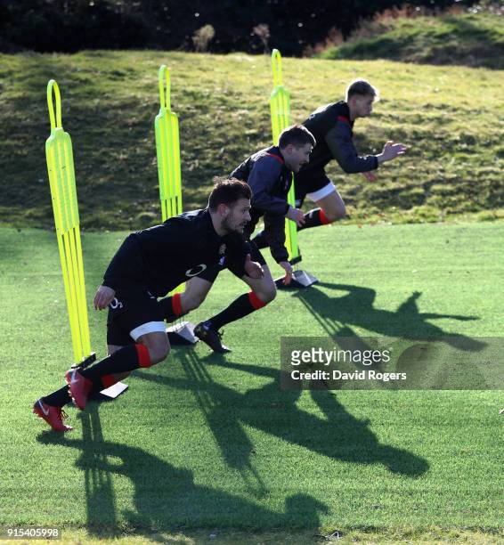 Danny Care , Richard Wigglesworth and Harry Mallinder take part in sprint training during the England training session held at Pennyhill Park on...