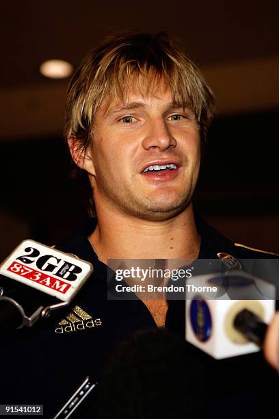 Shane Watson of Australia speak to the media during a press conference upon their return to Australia at Sydney International Airport on October 7,...