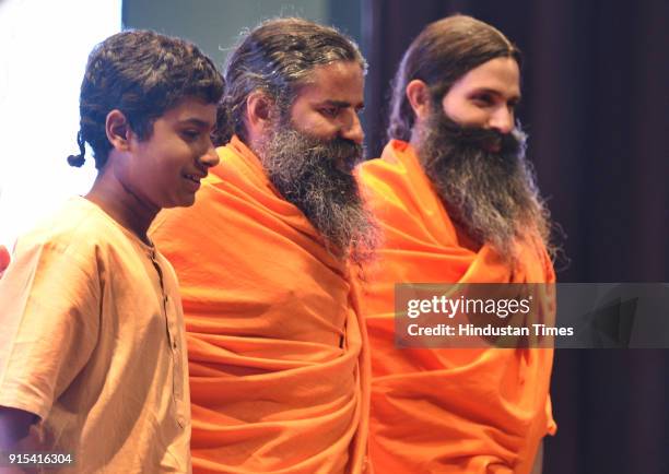 Naman Jain , Swami Baba Ramdev and Kranti Prakash Jha during a press conference to announce the mega show, 'Swami Ramdev: Ek Sangharsh' on Discovery...