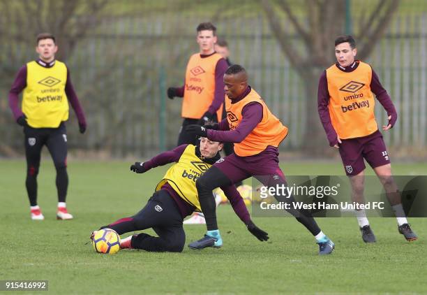 New signing Patrice Evra with Mark Noble in training as West Ham United Unveil New Signing Patrice Evra at Rush Green on February 7, 2018 in Romford,...