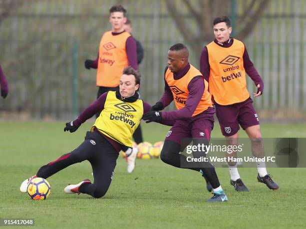 New signing Patrice Evra with Mark Noble in training as West Ham United Unveil New Signing Patrice Evra at Rush Green on February 7, 2018 in Romford,...