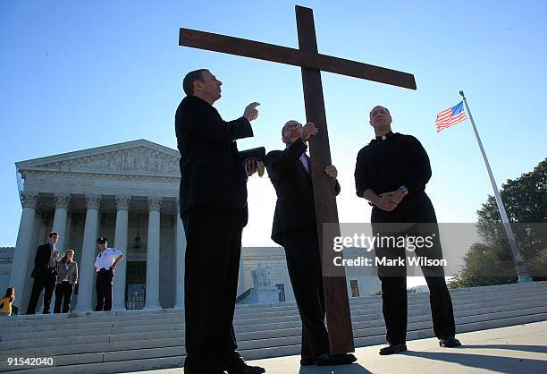 Rev. Rob Schenck president of the National Clergy President, Rev. Patrick Mahoney of the Christian Defense Coalition and Father James Heyd hold a...