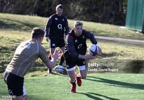Harry Mallinder runs with the ball during the England training session held at Pennyhill Park on February 7, 2018 in Bagshot, England.