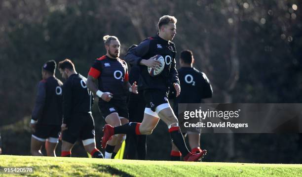 Harry Mallinder runs with the ball during the England training session held at Pennyhill Park on February 7, 2018 in Bagshot, England.