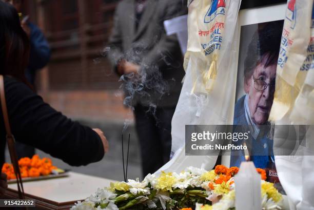 Nepalese people offering flower towards poster of Legendary Elizabeth Hawley during the condolence meeting at Nepal Tourism Board, Kathmandu, Nepal...