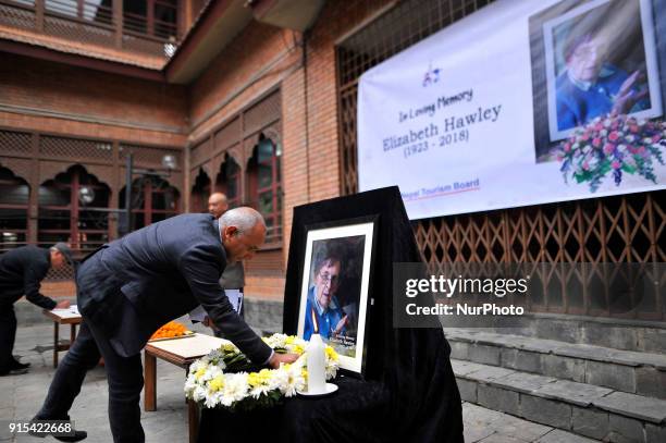 Of Nepal Tourism Board Deepak Raj Joshi offering flower towards poster of Legendary Elizabeth Hawley during the condolence meeting at Nepal Tourism...