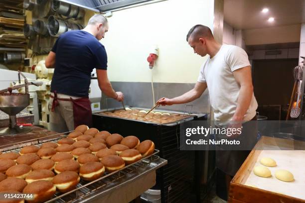 Staff of Krakow's well-known bakery 'Cichowscy' produces donuts for Fat Thursday. Fat Thursday is a traditional Catholic Christian feast on the last...