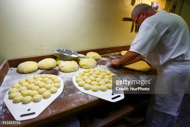 Staff of Krakow's well-known bakery 'Cichowscy' produces donuts for Fat Thursday. Fat Thursday is a traditional Catholic Christian feast on the last...