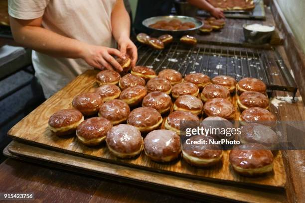 Staff of Krakow's well-known bakery 'Cichowscy' produces donuts for Fat Thursday. Fat Thursday is a traditional Catholic Christian feast on the last...
