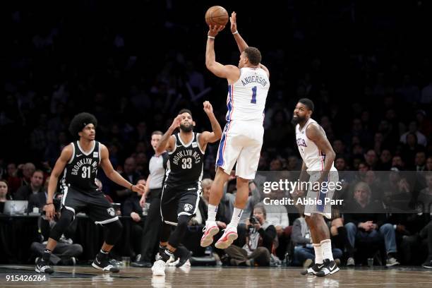 Justin Anderson of the Philadelphia 76ers takes a shot against Allen Crabbe of the Brooklyn Nets in the second quarter during their game at Barclays...