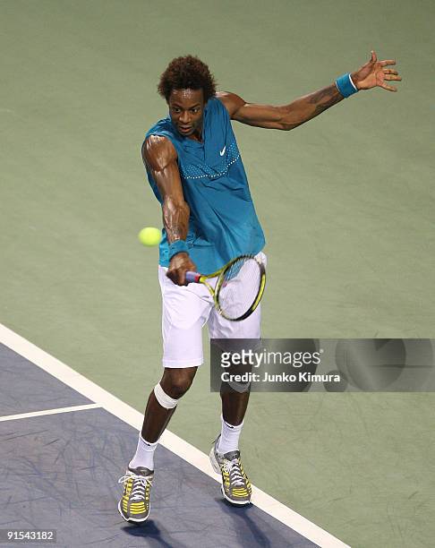 Gael Monfils of France plays a backhand in his match against Marco Chiudinelli of Switzerland during day three of the Rakuten Open Tennis tournament...