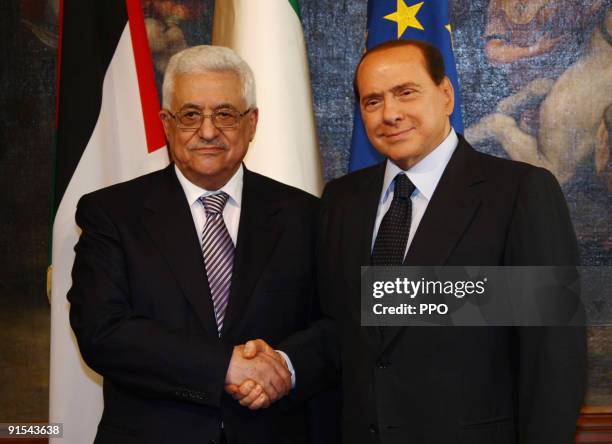 In this handout image provided by the Palestinian Press Office, Palestinian President Mahmoud Abbas meets with Italian Prime Minister Silvio...