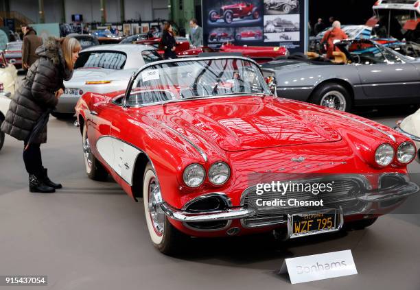 Visitor looks at a Chevrolet Corvette Roadster 1961 displayed during a press preview before a mass auction of vintage vehicles organised by Bonhams...