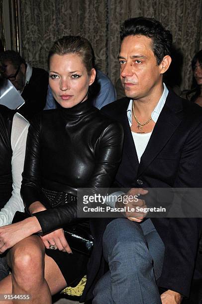 Kate Moss and Jamie Hince attend the Miu Miu Pret a Porter show as part of the Paris Womenswear Fashion Week Spring/ Summer 2010 on October 7, 2009...