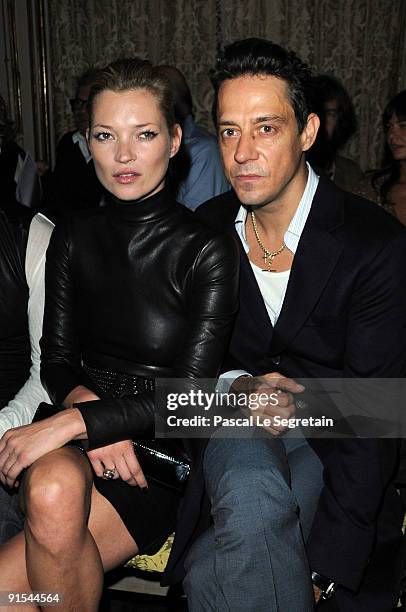 Kate Moss and Jamie Hince attend the Miu Miu Pret a Porter show as part of the Paris Womenswear Fashion Week Spring/ Summer 2010 on October 7, 2009...