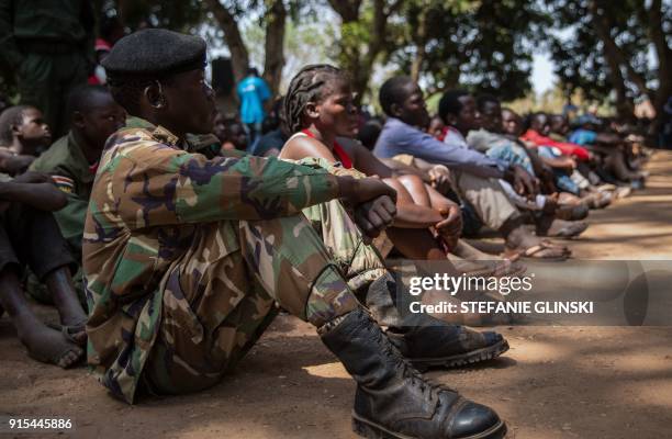 Newly released child soldiers attend sit as they attend their release ceremony in Yambio, South Sudan, on February 7, 2018. More than 300 child...