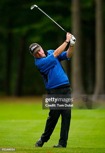 Adrian Ambler takes a shot from the 18th fairway during the SkyCaddie PGA Fourball Championship at Forest Pines Golf Club on October 7, 2009 in...