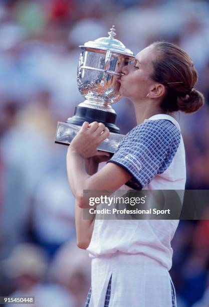 Iva Majoli of Croatia kissing the trophy after defeating Martina Hingis of Switzerland in the Women's Singles Final of the French Open Tennis...