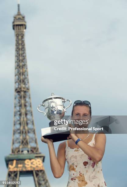 Iva Majoli of Croatia poses with the trophy in front of the Eiffel Tower after defeating Martina Hingis of Switzerland in the Women's Singles Final...