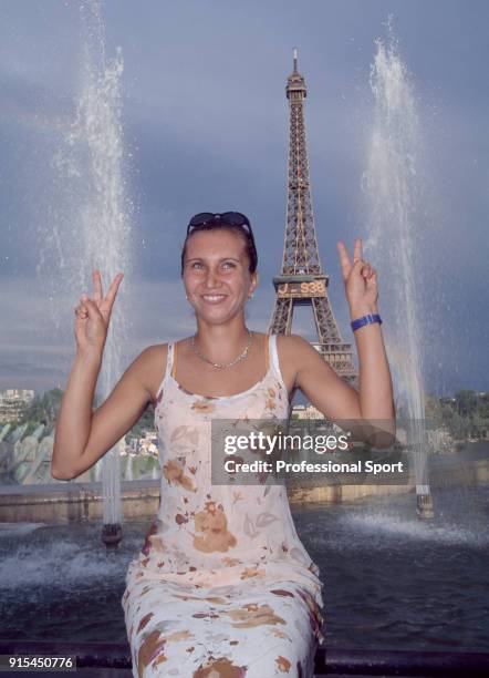 Iva Majoli of Croatia poses in front of the Eiffel Tower after defeating Martina Hingis of Switzerland in the Women's Singles Final of the French...