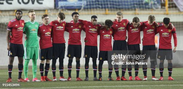 The Manchester United U19s team take part in a minute's silence to commemorate the 60th anniversary of the Munich Air Disaster ahead of the UEFA...