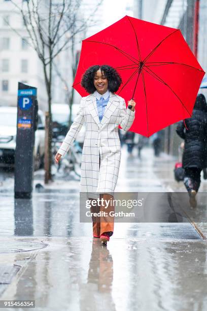 Yara Shahidi is seen wearing Tory Burch coat, button-down and trousers with Phillip Lim 3.1 mules and David Yurman jewelry in Midtown on February 7,...