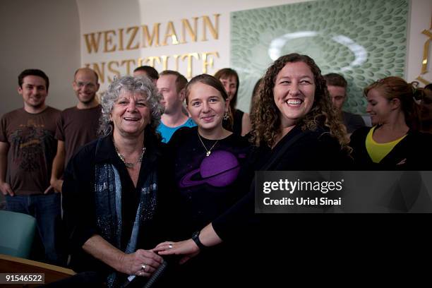 Israeli scientist Ada Yonath, a leading researcher in the structural biology field, poses for a photo with her daughter and granddaughter during a...