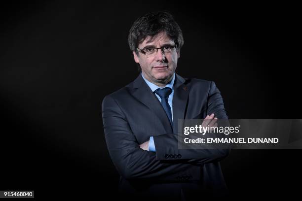 Exiled former Catalan leader Carles Puigdemont poses during a photo session in Brussels on February 7, 2018.
