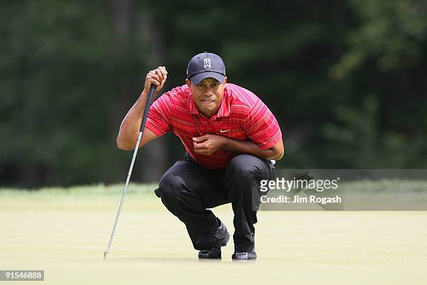 Tiger Woods lines up a putt during the final round of the Deutsche Bank Championship held at TPC Boston on September 7, 2009 in Norton, Massachusetts.