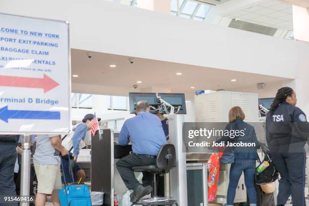 airline passengers at crowded tsa security checkpoint - airport authority stock pictures, royalty-free photos & images