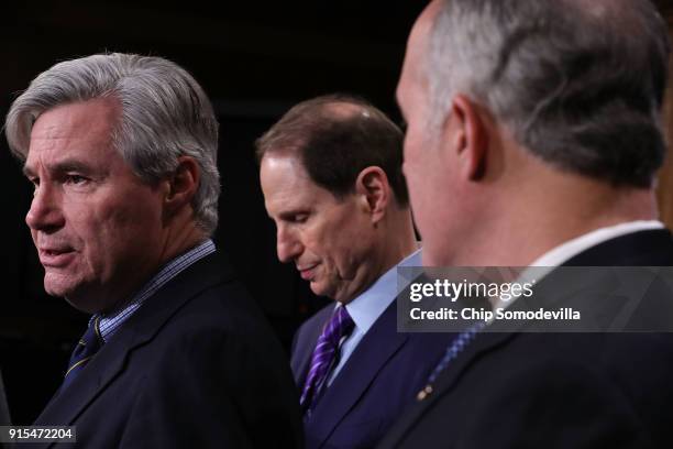 Sen. Sheldon Whitehouse , Sen. Ron Wyden and Sen. Robert Casey criticize the Tax Cuts and Jobs Act during a news conference at the U.S. Capitol...