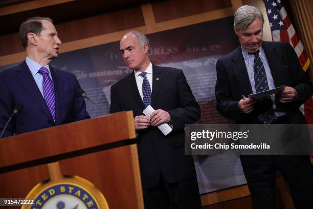 Sen. Ron Wyden , Sen. Robert Casey and Sen. Sheldon Whitehouse criticize the Tax Cuts and Jobs Act during a news conference at the U.S. Capitol...