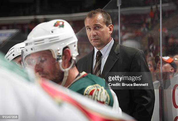 Head Coach Todd Richards of the Minnesota Wild looks on from the bench area during the preseason NHL game against the Philadelphia Flyers at the...